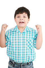 Image showing Portrait of a eigth year old boy clenching his fists and screami