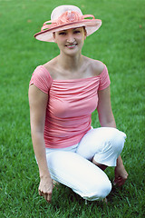 Image showing Woman in a pink straw hat