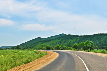 Image showing Country road clouds and hill 'sopka'