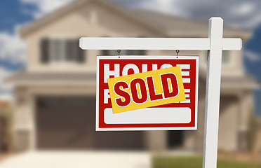 Image showing Sold Home For Sale Sign in Front of New House 