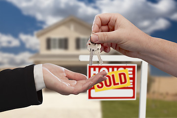 Image showing Handing Over the House Keys in Front of Sold New Home