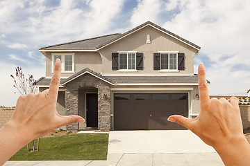 Image showing Female Hands Framing Beautiful House