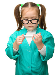 Image showing Cute little girl is playing doctor