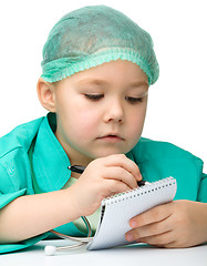 Image showing Cute little girl is playing doctor