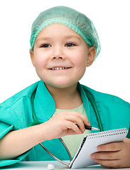 Image showing Cute little girl is playing doctor