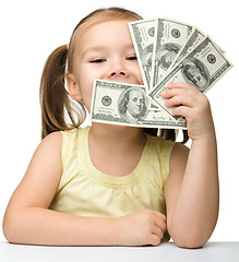 Image showing Cute little girl with paper money - dollars