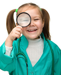 Image showing Little girl is playing doctor