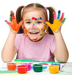 Image showing Portrait of a cute girl with painted hands