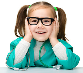 Image showing Little girl is playing doctor with stethoscope