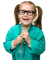 Image showing Cute little girl is playing doctor