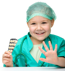 Image showing Cute little girl is playing doctor