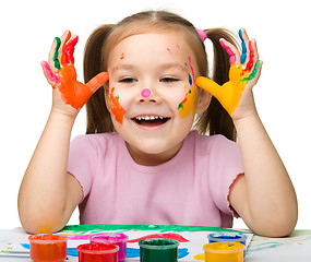 Image showing Cheerful girl with painted hands