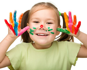 Image showing Portrait of a cute girl with painted hands