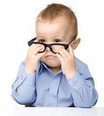 Image showing Portrait of a cute little boy wearing glasses