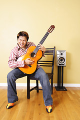 Image showing Young guitar player