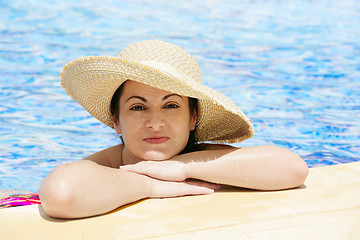Image showing young beautiful woman at the pool in summer