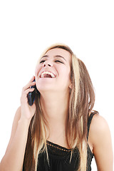 Image showing Young beautiful woman bursting out laughing on cellphone. 