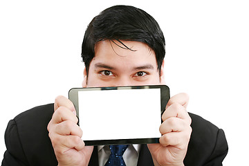 Image showing Young businessman holding a touch pad tablet pc on isolated whit