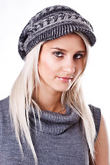 Image showing Fashionable young woman in gray sweater and cap