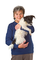 Image showing Female senior with puppy 