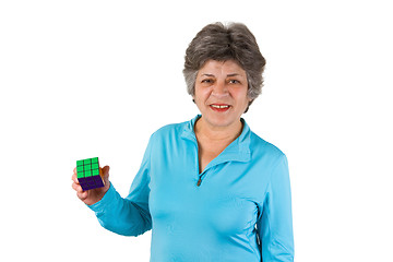 Image showing Smiling female senior holding a cube
