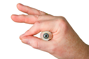 Image showing Hand holding glass eye