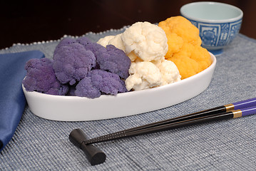 Image showing Purple, white and orange cauliflower in white serving dish