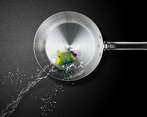 Image showing Angelfish jumping to frying pan