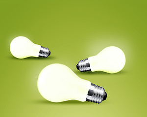 Image showing Three glowing Light bulb idea on green background