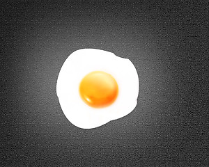 Image showing Fried egg on black background