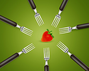 Image showing one strawberry between set of forks