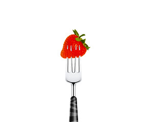Image showing Strawberry pierced by fork,  isolated on white background 