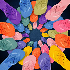 Image showing Colorful Flip Flops on circle shape