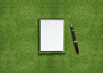 Image showing Blank notebook on grass