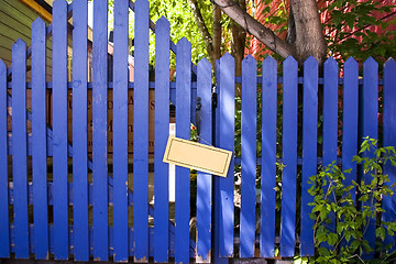 Image showing Blue Fenced Door with a Blank Sign