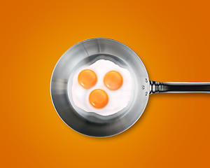 Image showing Three Fried eggs in a frying pan 