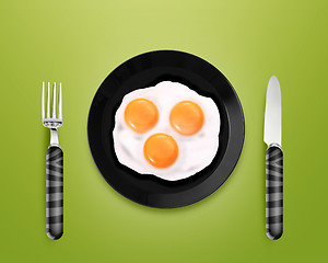 Image showing Three fried eggs on a Plate