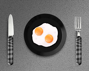 Image showing Two fried eggs on a Plate