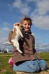 Image showing little girl and her puppy