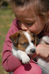 Image showing child and puppy