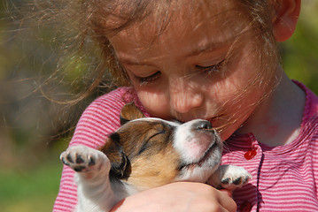 Image showing little girl and puppy