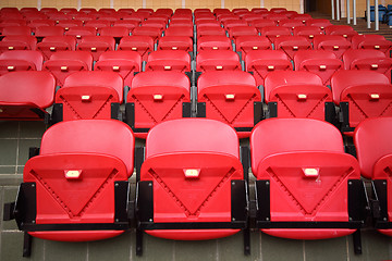 Image showing Bright red stadium seats
