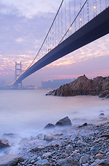 Image showing long bridge in sunset hour