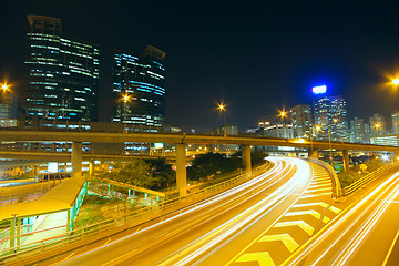Image showing Traffic at night with traces of lights left by the cars on a hig