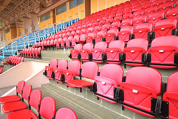 Image showing Bright red stadium seats