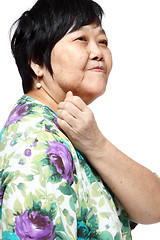 Image showing senior woman holding her aching back 