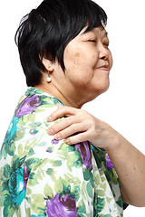 Image showing senior woman holding her aching back 