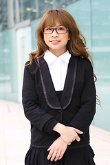 Image showing portrait of a young business woman in an office 