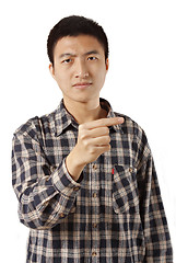 Image showing Casual young man pointing left