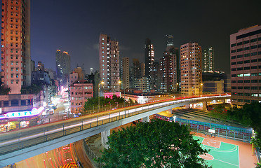 Image showing Traffic at night with traces of lights left by the cars on a hig